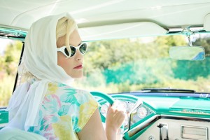 Betty driving "recycled" vintage car